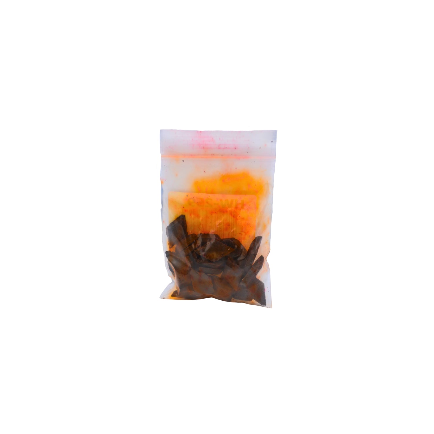 A small clear plastic pouch containing red dye chips shown on a plain white background.