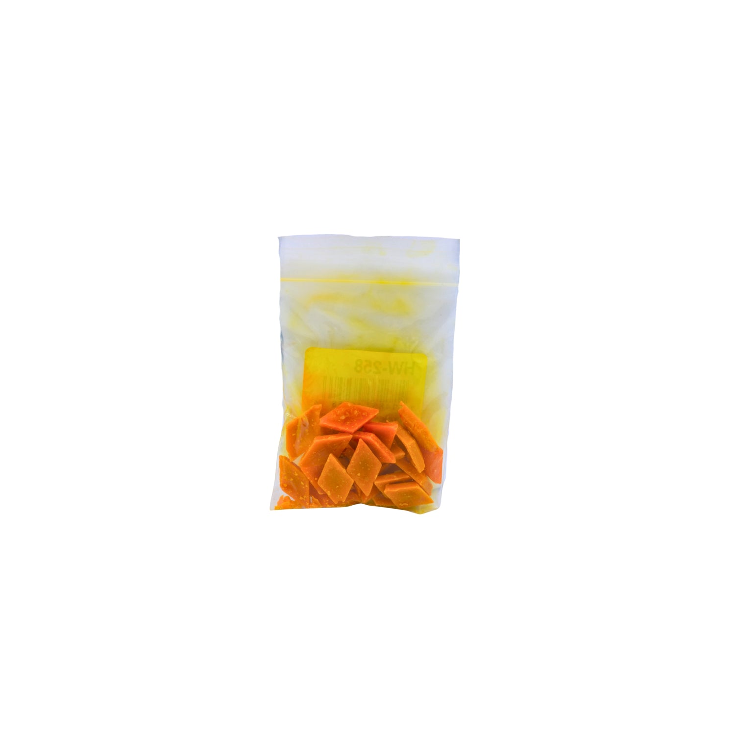 A small clear plastic pouch containing yellow dye chips shown on a plain white background.