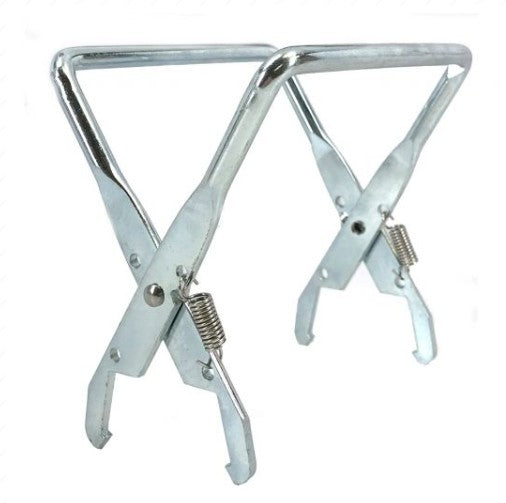 A silver, spring-loaded metal beekeeping frame grip tool designed to clamp onto and lift wooden hive frames during inspections
