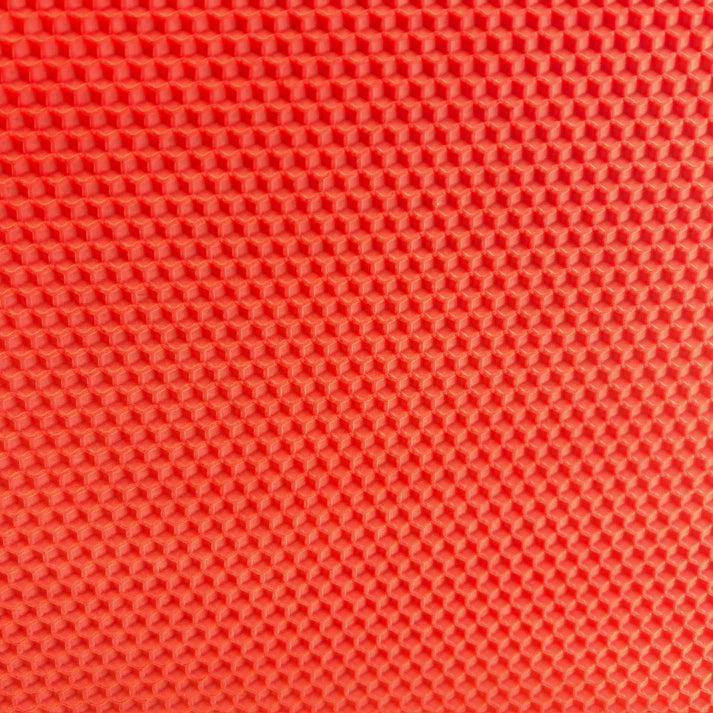A close up of an adobe orange beeswax craft sheet 
