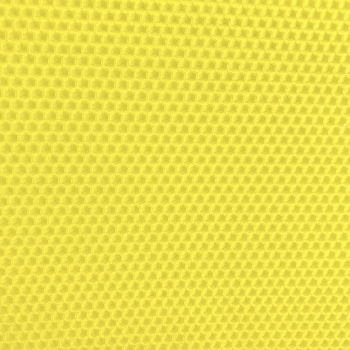 A close up of a bring yellow beeswax craft sheet 