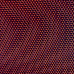 A close up of a burgundy beeswax craft sheet 