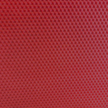 A close up of a Christmas red beeswax craft sheet 