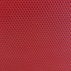 A close up of a Christmas red beeswax craft sheet 