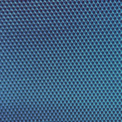 A close up of a dark blue beeswax craft sheet 