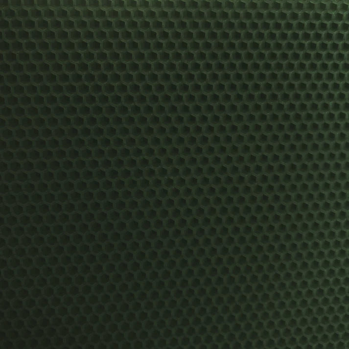 A close up of a dark green beeswax craft sheet 