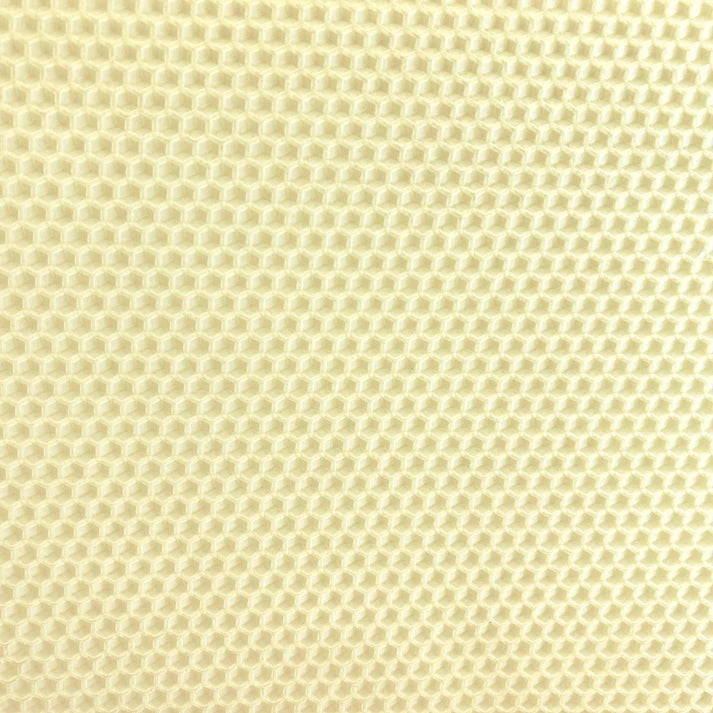 A close up of an ivory beeswax craft sheet 
