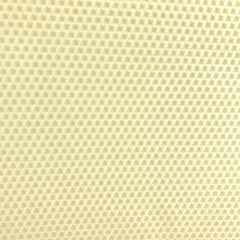 A close up of an ivory beeswax craft sheet 