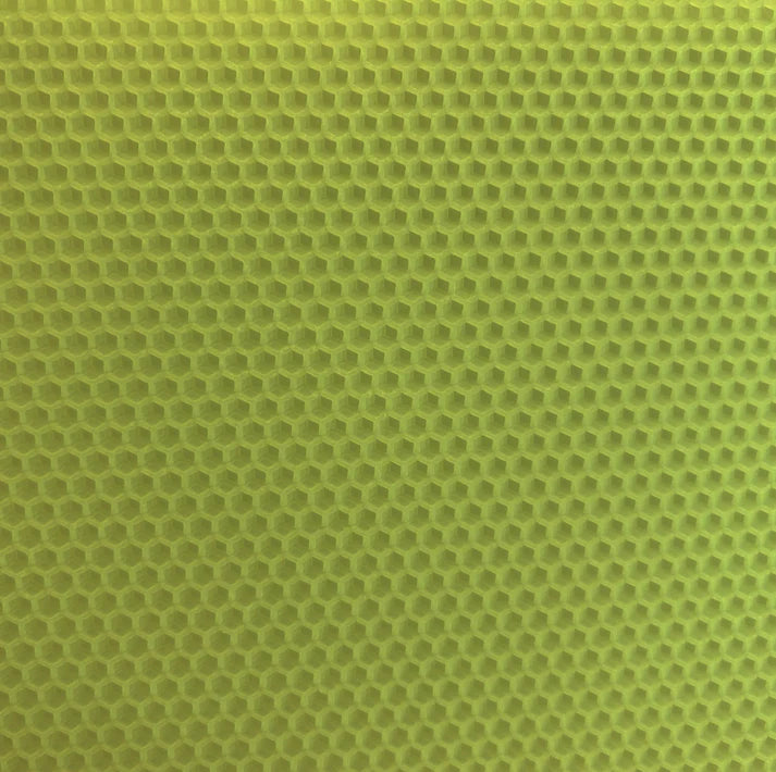 A close up of a light green beeswax craft sheet 