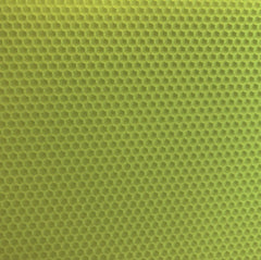 A close up of a light green beeswax craft sheet 