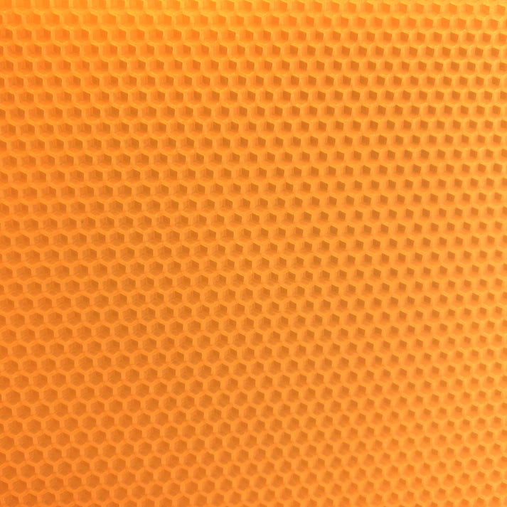 A close up of a peach beeswax craft sheet 