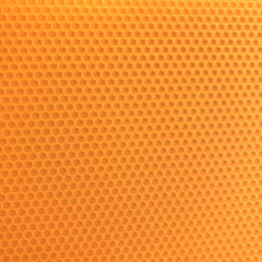 A close up of a peach beeswax craft sheet 