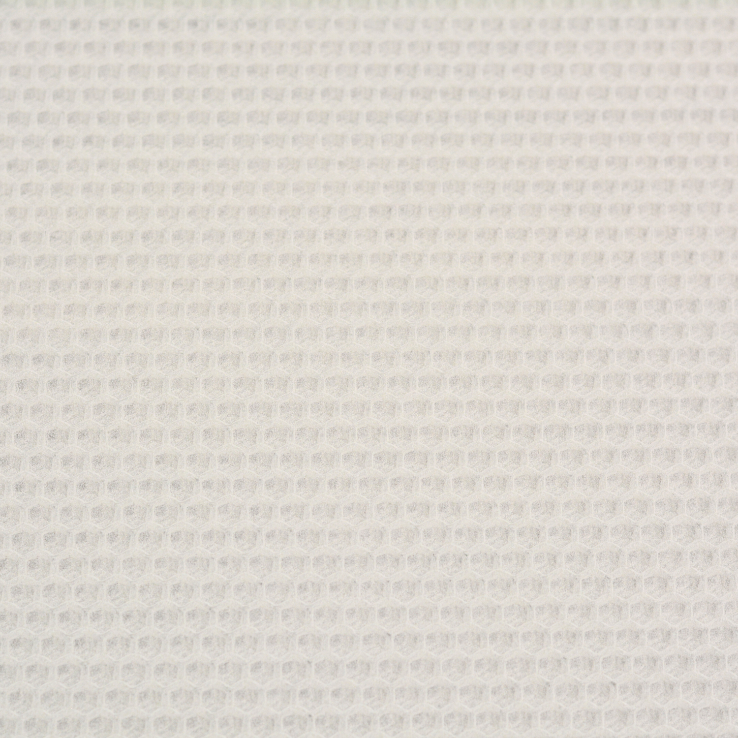 A close up of a white beeswax craft sheet 
